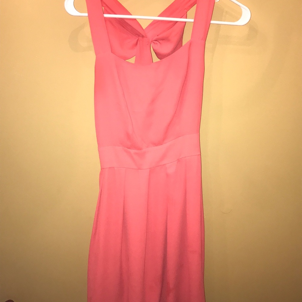 Coral dress with bow detail on the back